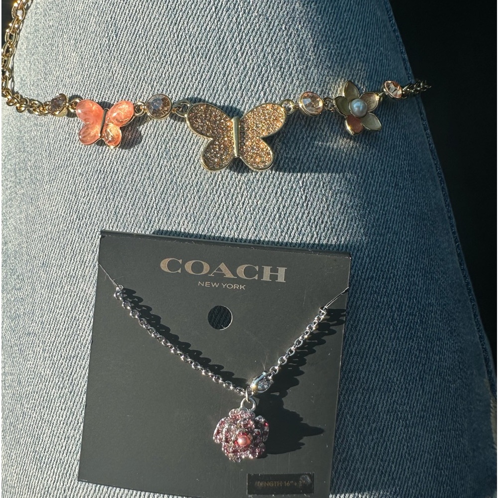 This beautiful rose necklace also needs a new home. No longer my style.